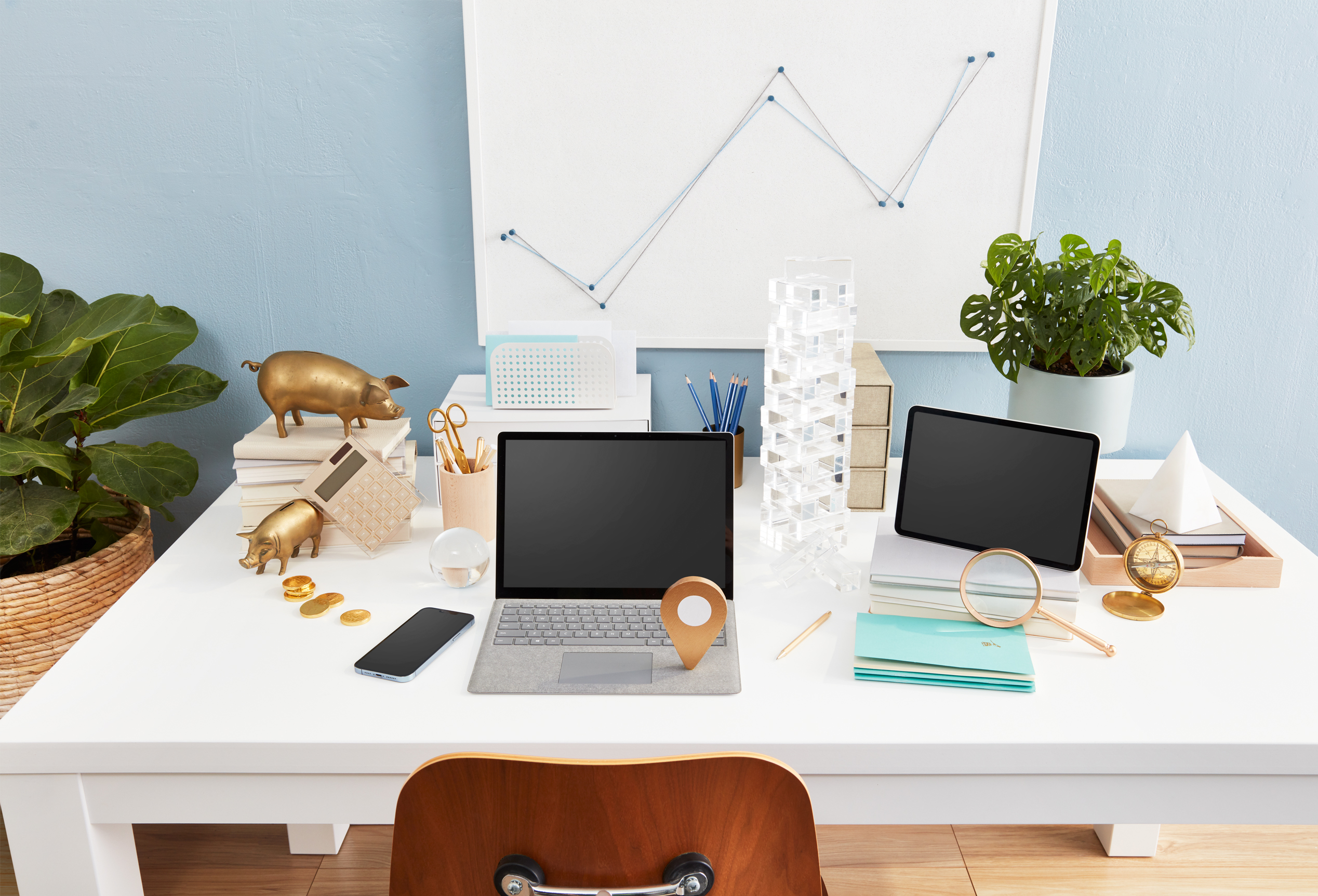 A home office desk is shown with a laptop.